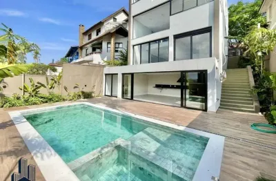 Condomínio são paulo ii - casa alto padrão no condomínio sp ii - zero km! moderna, 4 suítes, gourmet e piscina!