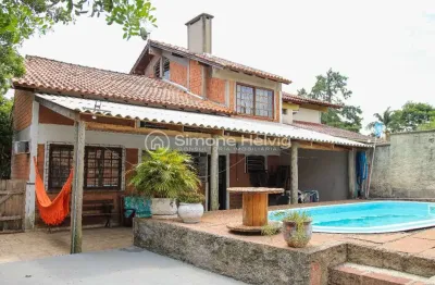 Casa com 3 quartos à venda na avenida assis brasil, 260, flórida, guaíba por r$ 590.000