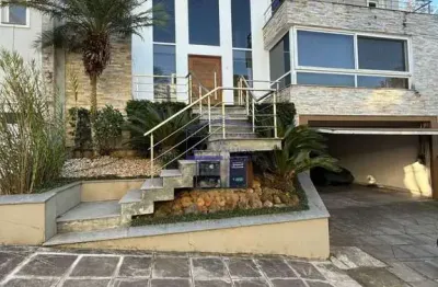 Imóvel de luxo em lomba do pinheiro: casa com 3 suítes, 3 salas e 6 vagas de garagem em porto alegre-rs