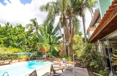 Elegance imóveis vende casa, 380m, 3 dormitórios, 3 suítes, closet, living de 4 ambientes, piscina e 4 vagas de garagem/box. comprar r$ 1.890.000,00.