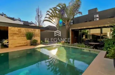 Elegance imóveis vende casa de cinema, 400m, 3 dormitórios, 3 suítes, churrasqueira, piscina aquecida, 6 vagas de garagem/box. comprar r$ 4.989.000,00