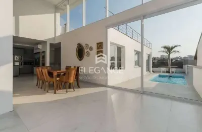 Elegance imóveis vende casa moderna 3 dormitórios suíte pátio com piscina 6 vagas box/garagem chacara das pedras porto alegre. comprar r$ 2.700.000,00