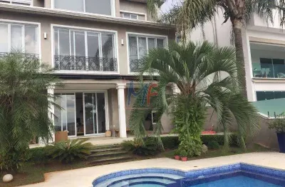 Ref 10.399 excelente casa em alphaville, sendo 4 suítes todas com ar condicionado, área gourmet, piscina, salas, 600 m² útil, 700 m² terreno.