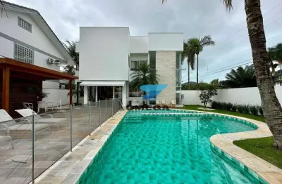 Casa à venda no condomínio jardim acapulco no guarujá | omega imóveis