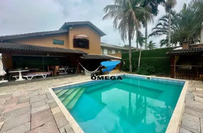 Casa à venda em condomínio jardim acapulco no guarujá | omega imóveis