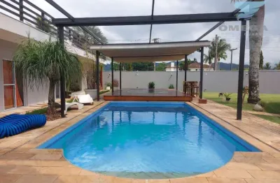 Casa à venda no condomínio jardim acapulco no guarujá | omega imóveis