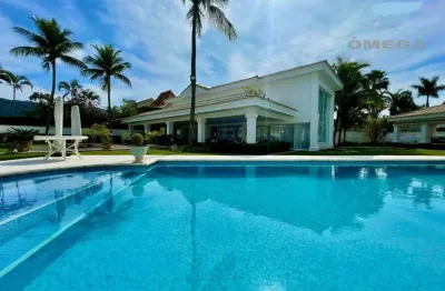 Casa à venda no condomínio jardim acapulco no guarujá | omega imóveis
