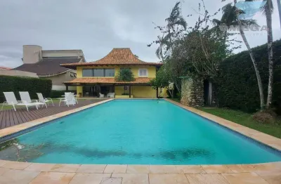Casa à venda no condomínio jardim acapulco no guarujá | omega imóveis