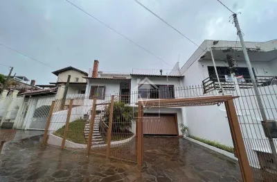 Casa com 4 dormitórios à venda, 390 m² por R$ 1.400.000,00 - Santa Fé - Porto Alegre/RS
