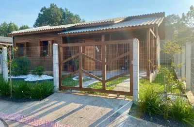 Casa mobiliada com 3 quartos, demais peças, amplo terreno em capão novo