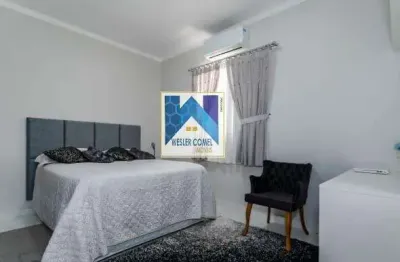 Casa térrea,  com 3 dormitórios,  sendo 1 suíte, a  cozinha, sala de jantar e salade estar/tv são integradas, 1 banheiro social, toda mobiliada com planejados sob medida, amplo qui