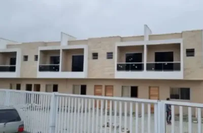 Sobrado em condomínio à venda no bairro itaóca, em mongaguá ** lado praia, em rua calçada.