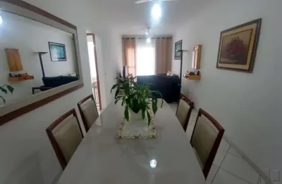 Apartamento de 2 dormitórios com vista lateral para o mar em praia grande sp.
