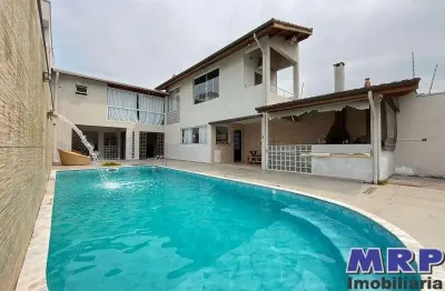 Casa com piscina à venda em ubatuba, bairro jardim beira rio. 4 dormitórios.