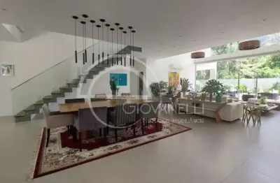 Luxuosa casa de 5 suítes em são conrado - rio de janeiro-rj: 911m² de arquitetura impecável e 4 vagas na garagem!