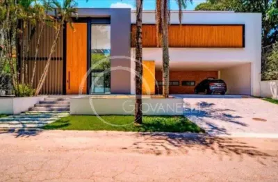 Mansão tríplex de alto luxo no jardins do itanhangá. 843m², 5 suítes, arquitetura autoral, lazer integrado e vista definitiva para a pedra da gávea.