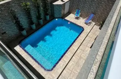 Casa isolada com piscina a 60 metros da praia no jardim real, praia grande