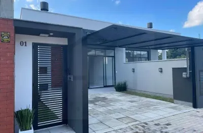 Casa baixa de 105m² com três dormitórios sendo uma suíte