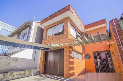 Casa com 4 quartos à venda na rua eudoro berlink, 482, auxiliadora, porto alegre por r$ 1.500.000