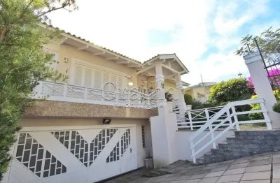 Casa com 5 quartos à venda na indianópolis, 240, três figueiras, porto alegre por r$ 2.000.000