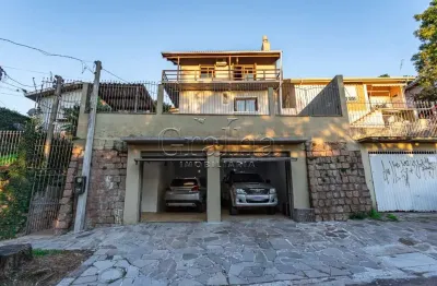 Casa em condomínio fechado com 3 quartos à venda na acesso dos hibiscos, 42, santa tereza, porto alegre por r$ 690.000