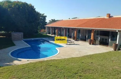 Oportunidade, chácara em condomínio, 3 dormitórios sendo 2 suítes, piscina, valor ótimo!