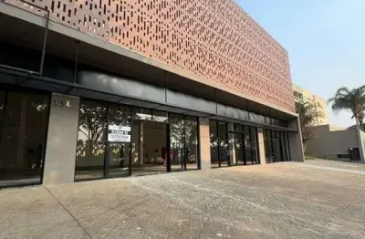 Lindo salão comercial novo para locação na av. caramuru, proximo da fiusa, edificio prizma, área da loja 156 m2 mais mezanino, vagas em frente a loja