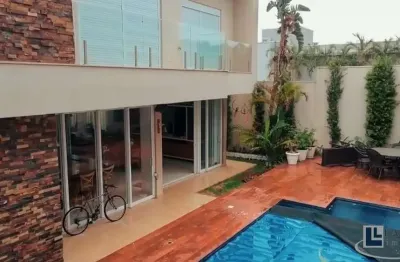 Maravilhoso sobrado altíssimo padrão para venda no charmoso alphaville 2 em bonfim paulista, 5 suites, gourmet e piscina em 414 m2 construidos