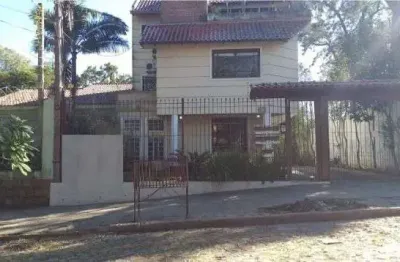 Casa em condomínio fechado com 4 quartos à venda na Rua Upamaroti, 1129, Cristal, Porto Alegre