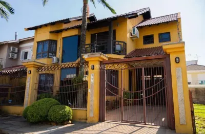 Casa com 3 quartos à venda na rua manacás, 692, loteamento bela vista, canoas por r$ 1.350.000