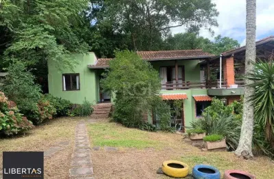 Terreno de 5.280 m², com 3 casas, no bairro ponta grossa, em porto alegre.