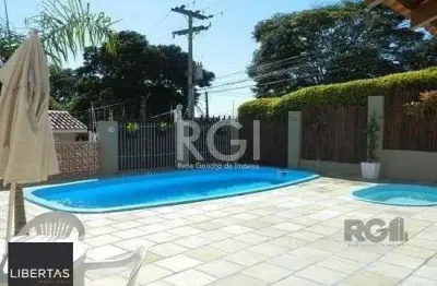 Casa em condomínio fechado com 3 quartos à venda na Rua Humberto de Campos, 601, Partenon, Porto Alegre