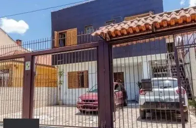 Casa com 4 quartos à venda na Rua Dona Firmina, 459, Partenon, Porto Alegre