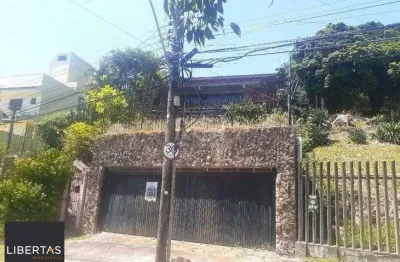 Casa com 5 quartos à venda na Rua Alcebíades Antônio dos Santos, 260, Nonoai, Porto Alegre