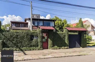 Casa com 3 quartos à venda na Avenida Guarujá, 140, Guarujá, Porto Alegre