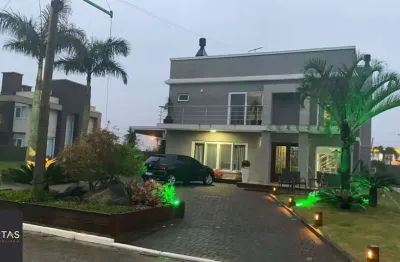 Casa sobrado no condomínio golden river em imbé com 4 dormitórios