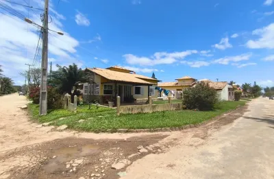 Casa no condomínio orla 500 — localizada na rua principal, próxima à praia