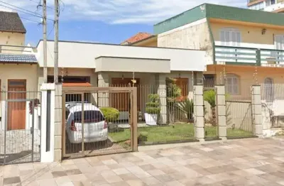 Casa com 4 quartos à venda na rua evaristo da veiga, 71, partenon, porto alegre por r$ 1.040.000