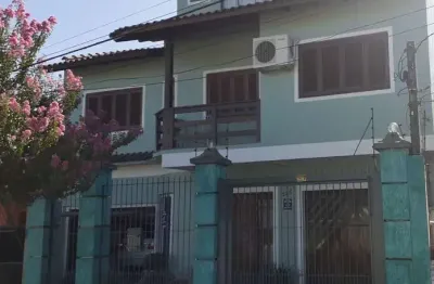 Casa com 4 quartos à venda na rua doutor telmo vergara, 556, partenon, porto alegre por r$ 1.350.000