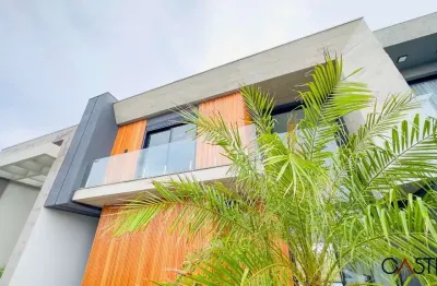 Casa em condomínio fechado com 4 quartos à venda na rua rio divisa, 32, centro, xangri-lá por r$ 1.790.000