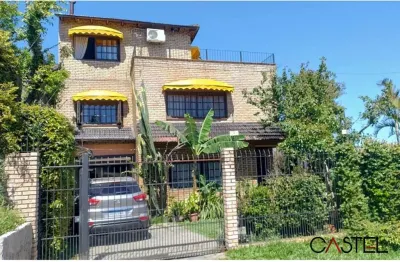 Casa com 4 quartos à venda na rua arapei, 325, cristal, porto alegre por r$ 495.000
