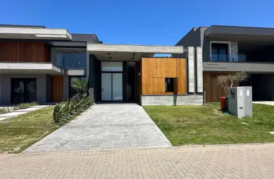 Casa em condomínio fechado com 4 quartos à venda na rua rio divisa, 36, centro, xangri-lá por r$ 1.690.000