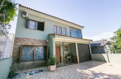 Casa com 3 quartos à venda na rua dário totta, 2114, camaquã, porto alegre por r$ 1.350.000