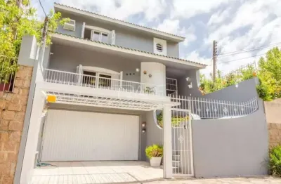 Casa com 3 quartos à venda na rua doutor barcelos, 654, tristeza, porto alegre por r$ 1.280.000