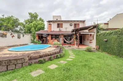 Casa com 3 quartos à venda na avenida guarujá, 140, guarujá, porto alegre por r$ 750.000