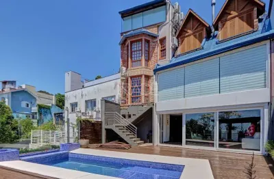 Casa com 4 quartos à venda na Rua Bororó, 157, Vila Assunção, Porto Alegre por R$ 1.800.000