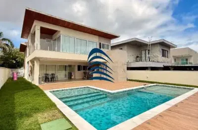 Casa em fino acabamento, nova, terreno na melhor quadra do condomínio, lote plano, 5 amplas suítes + gabinete, sala de jantar, sala de estar com pé direito duplo, cozinha com integração com área gourm