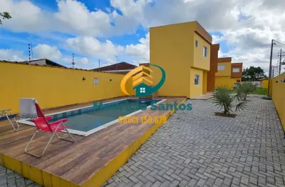 Sobrado em condomínio em itanhaém, bairro santa terezinha, próximo a praia, 2 suítes, lavabo, lavanderia e churrasqueira, residencial com piscina com cascata!!