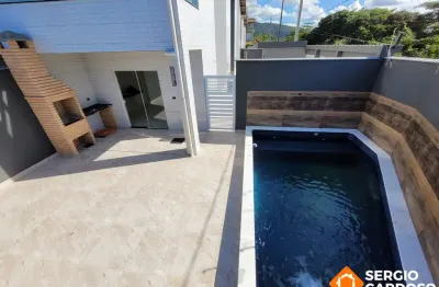 Sobrado condomínio fechado frente ao mar com piscina individual itanhaém sp
