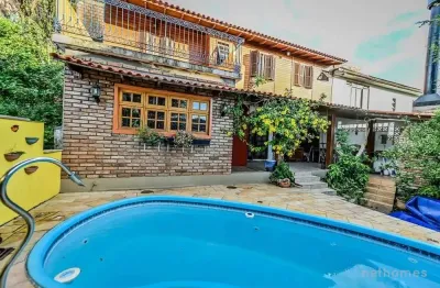 Casa em condomínio fechado com 4 quartos à venda na acesso das figueiras, 108, santa tereza, porto alegre, 200 m2 por r$ 650.000